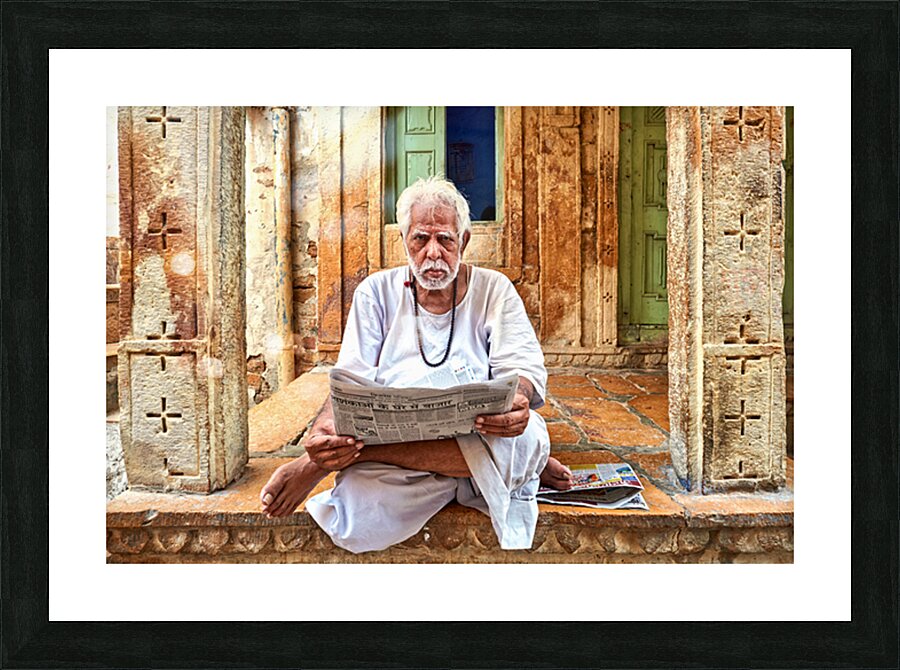Man reads newspaper on street in Jaisalmer Rajasthan India Picture Frame print