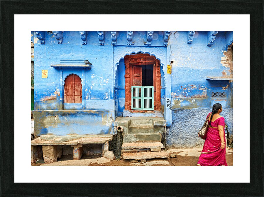 Walking along the blue streets of Jodhpur in Rajasthan India Picture Frame print