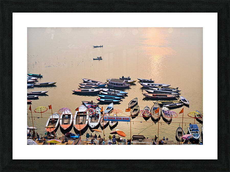 Sunrise at Ganges River in Varanasi with boats and activities Picture Frame print