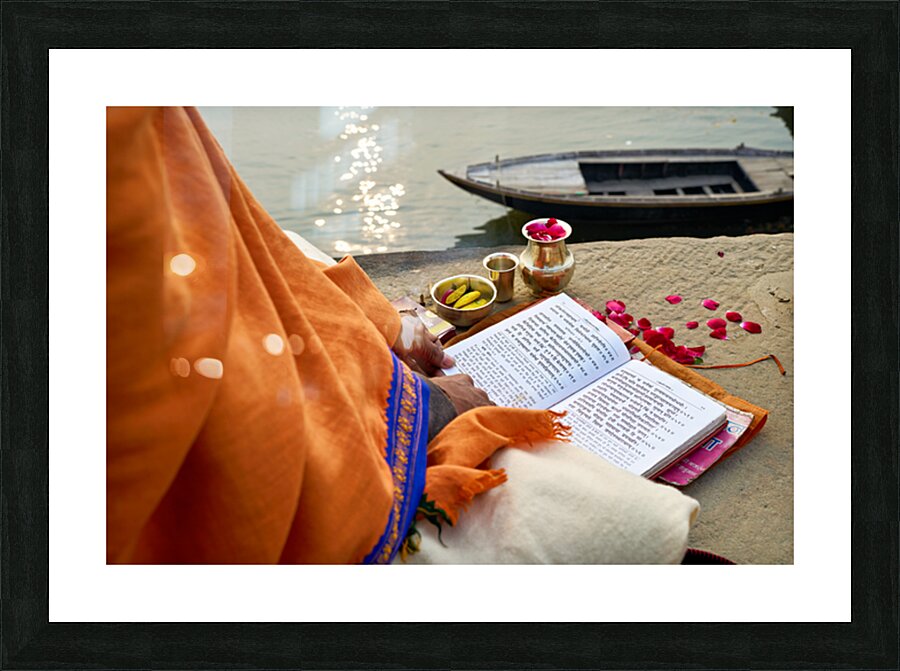Praying by the ganges river in varanasi india Picture Frame print