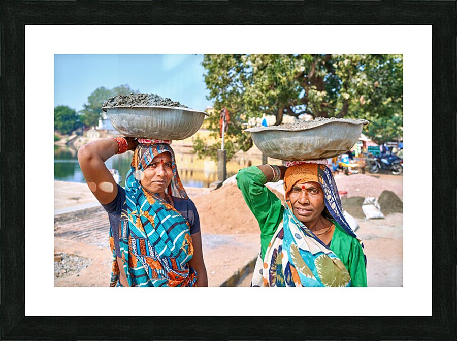 Women carry materials in Varanasi near the river bank Picture Frame print