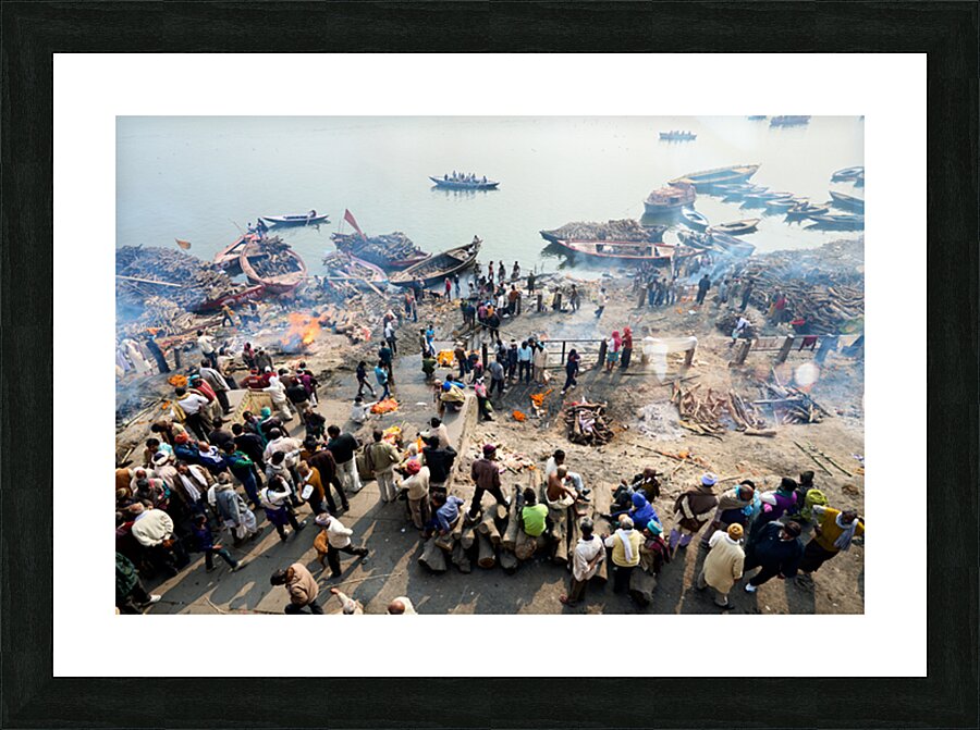 Cremation rites by the river Ganges in Varanasi India Picture Frame print