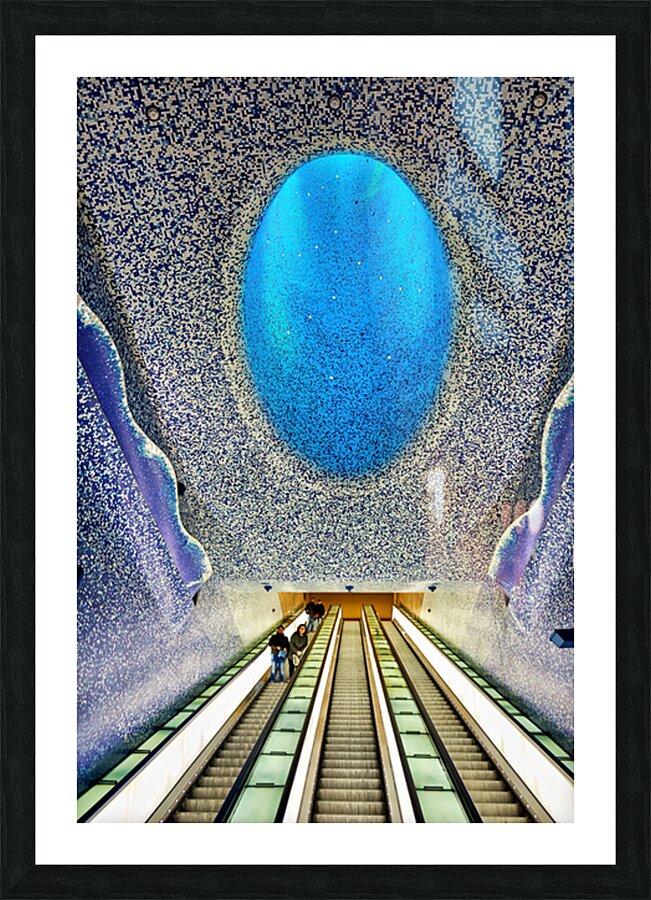 People travel down escalators at Toledo station in Naples Metro Picture Frame print