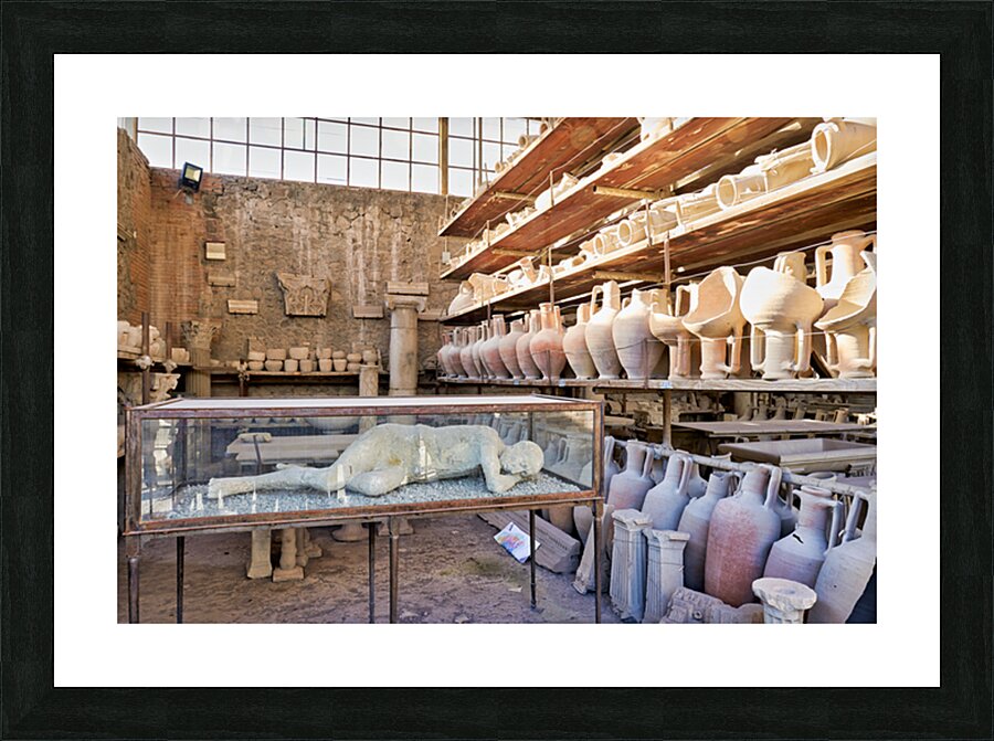 Pompeii site showing artifacts and a plaster cast of a victim Picture Frame print