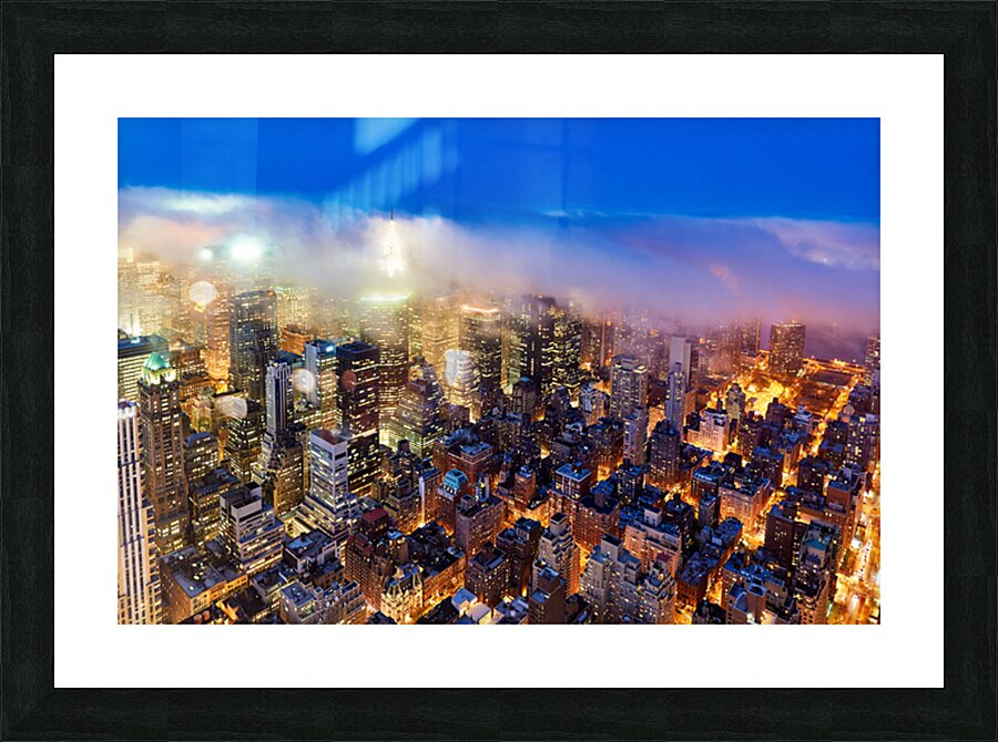 Aerial view shows Manhattan skyline at dusk with city lights Picture Frame print