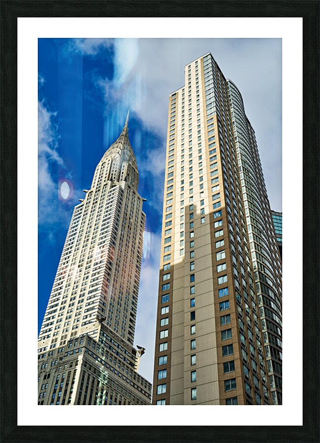 Chrysler Building stands tall among modern structures in Manhatt Picture Frame print