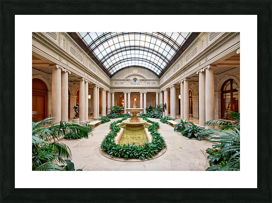 People walk around the courtyard at the Frick Collection in New  Picture Frame print