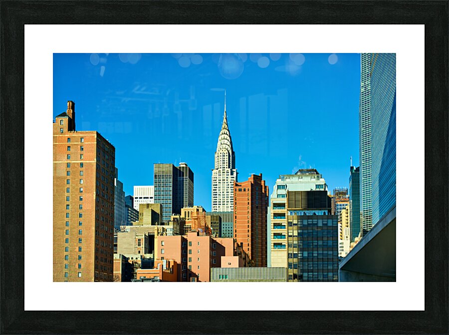 Chrysler Building stands tall among Manhattan buildings in New Y Picture Frame print