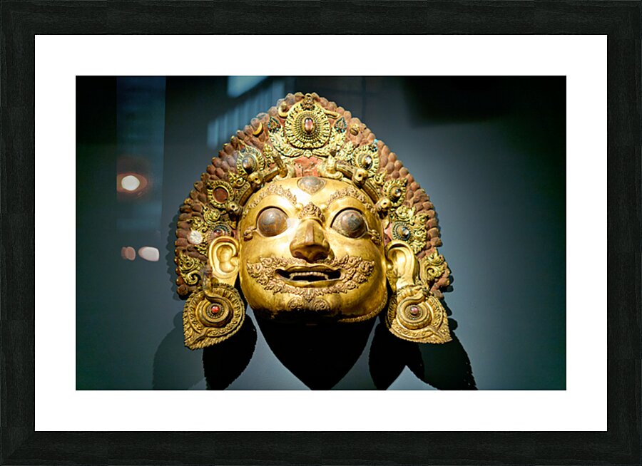 Golden face mask displayed at the Asian Art Gallery in Manhattan Picture Frame print