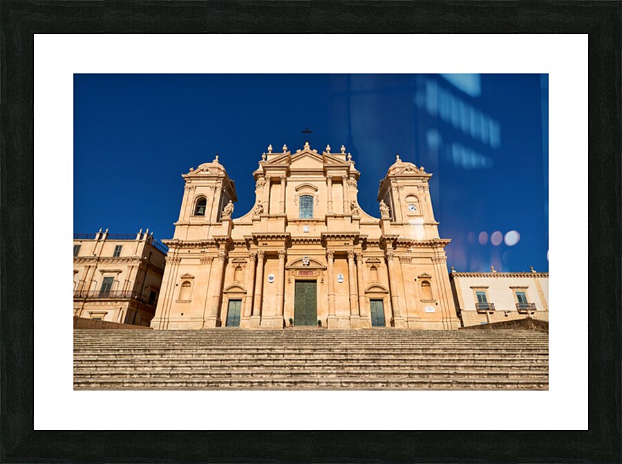 Noto Cathedral stands tall in Sicily under a clear blue sky Picture Frame print