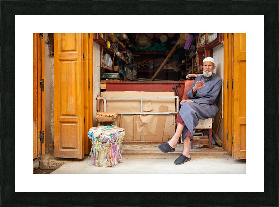 Old man in second hand shop at medina in Fez Morocco Picture Frame print