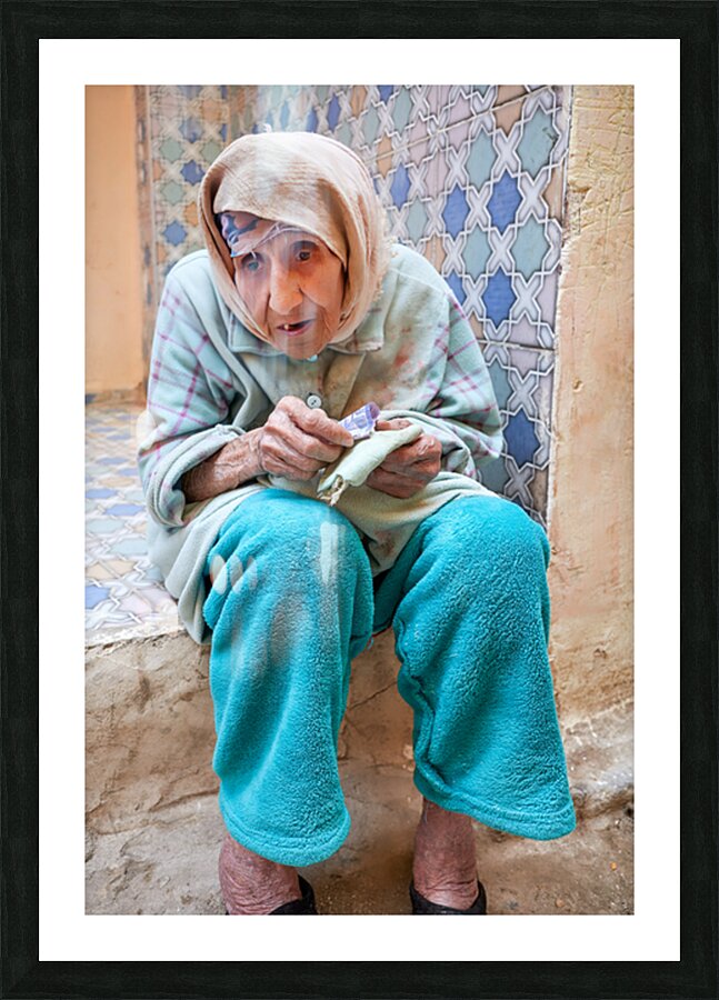 Beggar sitting in Fez Morocco with worn clothes and hands Picture Frame print