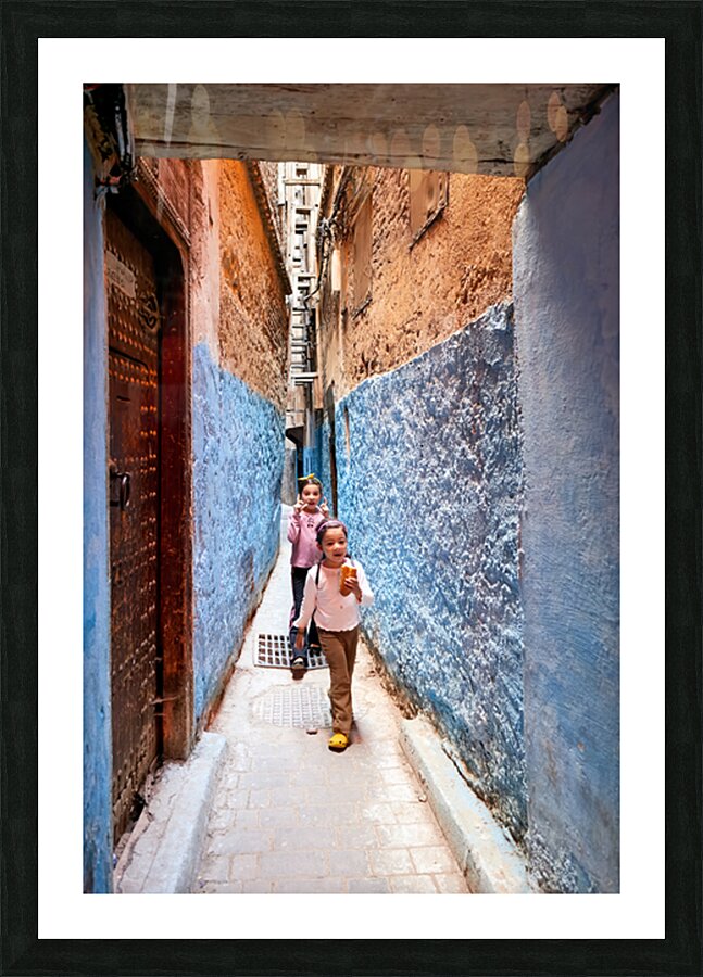 Children play in the alleys of the Medina in Fez Morocco Picture Frame print