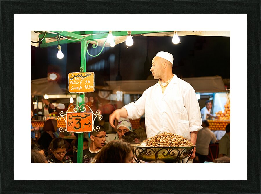 Snail dinner served at street vendors in Marrakech night market Picture Frame print