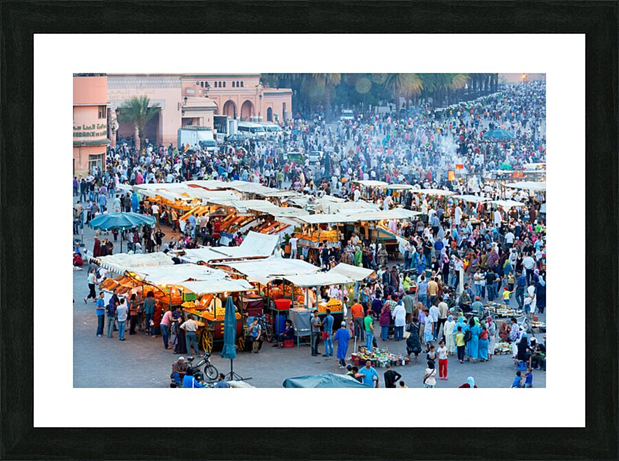 Sunset at Djema el Fna square in Marrakesh with lively crowds Picture Frame print