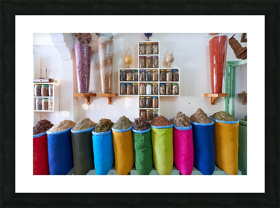 Herbal remedy shop in Marrakesh showing colorful bags of herbs Picture Frame print