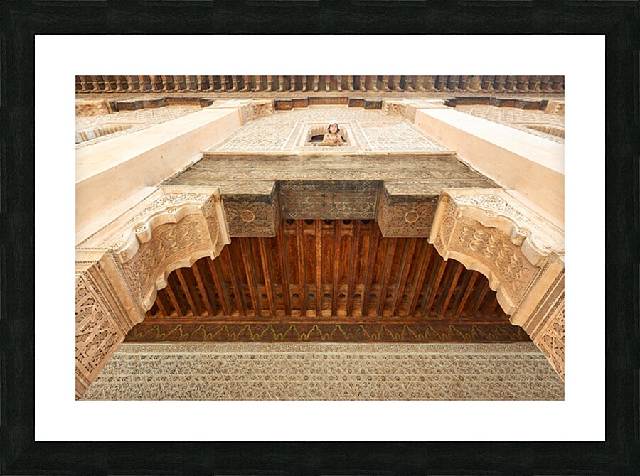 Child looks out from window of Madrasa Ben Youssef in Marrakesh Picture Frame print