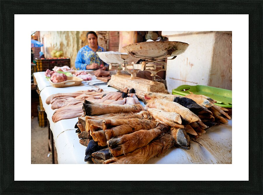 Butcher working in Meknes souk with various cuts of meat Picture Frame print