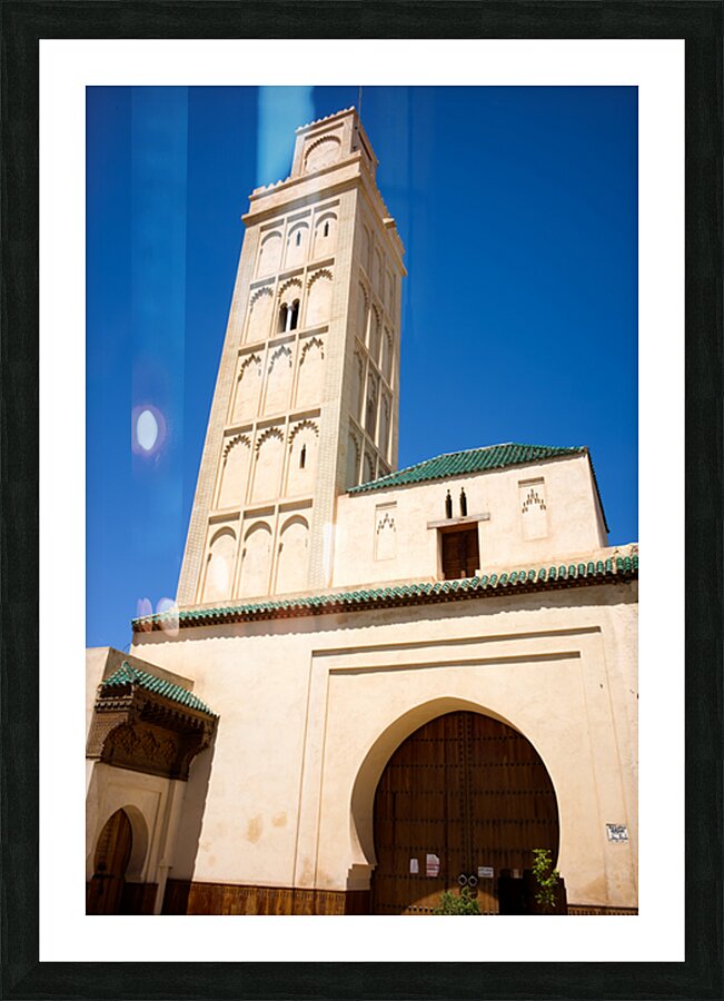 Visit Meknes mosque in Morocco with a tall tower and clear sky Picture Frame print
