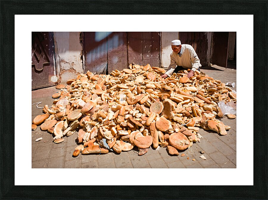 Collecting bread in Meknes Morocco during the day Picture Frame print