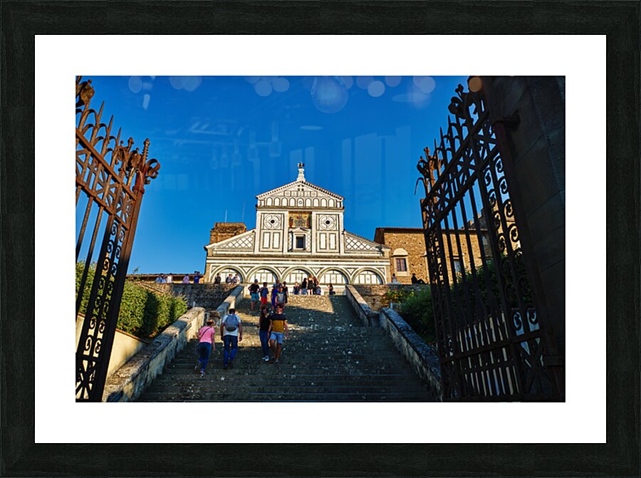 Visitors walk up the stairs to Basilica di San Miniato in Floren Picture Frame print