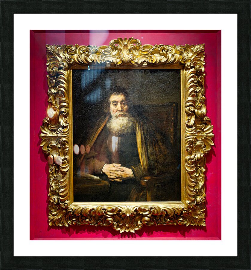 A rabbi sits calmly in a chair with hands together Picture Frame print