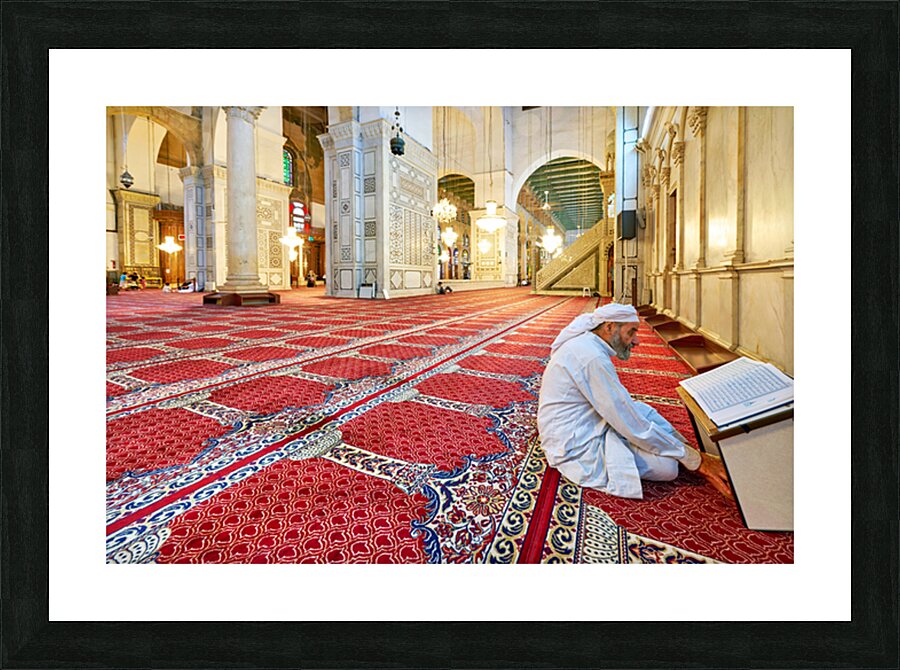 Visitor reading Quran in Umayyad Mosque in Damascus Picture Frame print