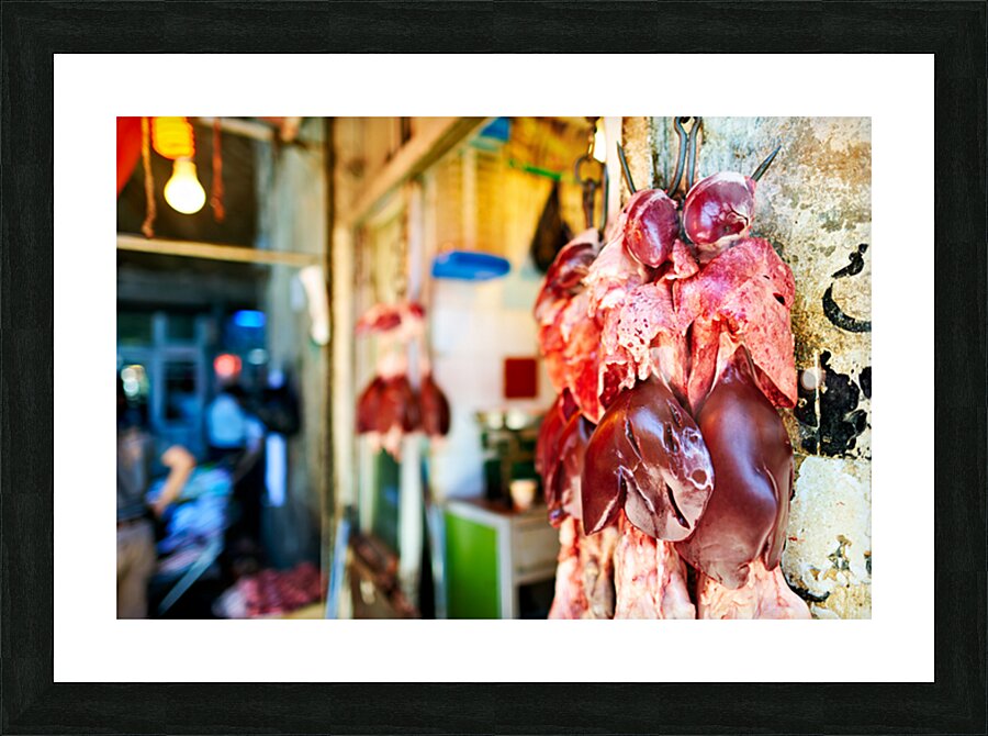 Butcher displays meat at souq in Aleppo Syria during the day Picture Frame print
