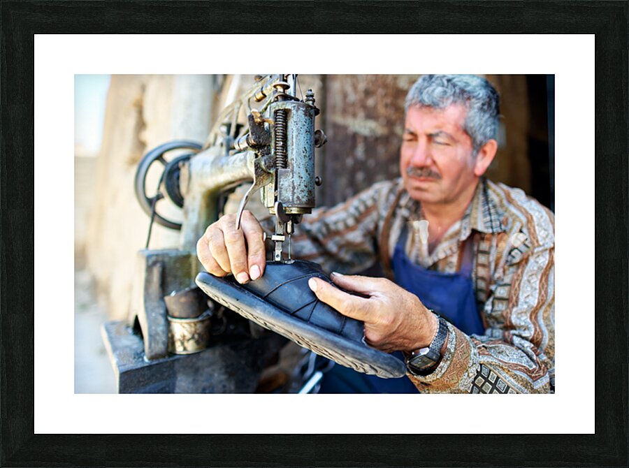 Shoemaker working in Aleppo souq in Syria Picture Frame print