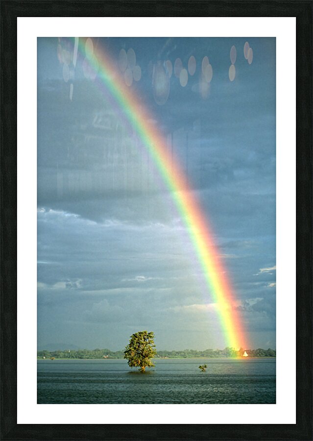 Rainbow shines over landscape in Myanmar after rainfall Picture Frame print