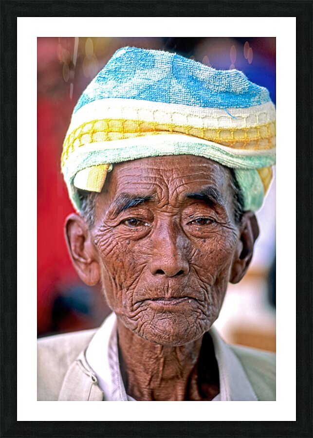 Portrait of an old man in Myanmar with a traditional head wrap Picture Frame print