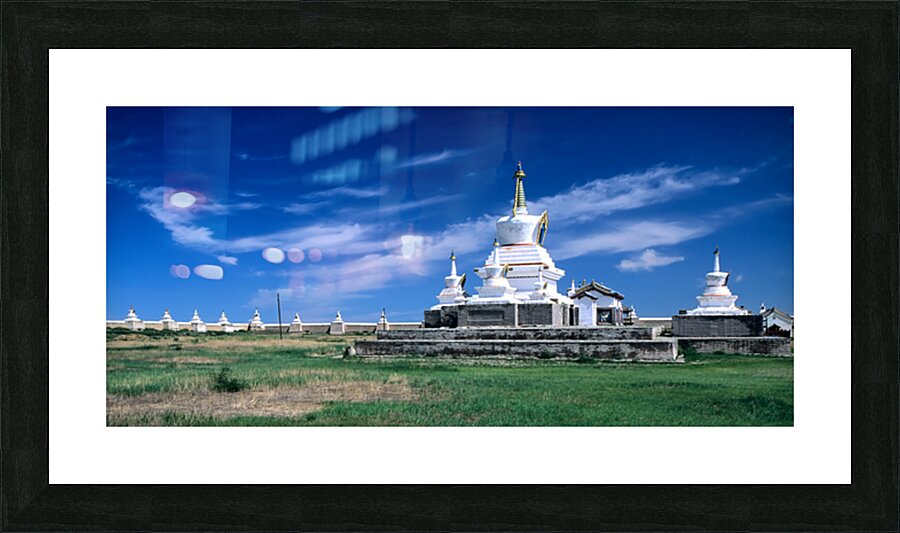 Erdene Zuu Monastery stands in Mongolia under a clear blue sky Picture Frame print