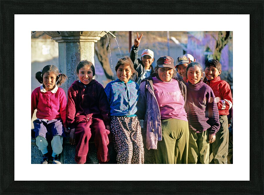 Smiling children and youth gather by a fountain. Picture Frame print