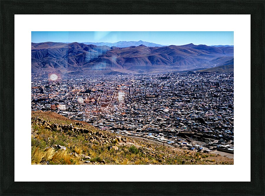 Panoramic view of a sprawling city in a mountain valley. Picture Frame print