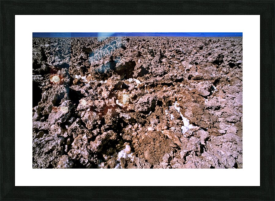 Salt encrusted desert floor under a bright blue sky. Picture Frame print
