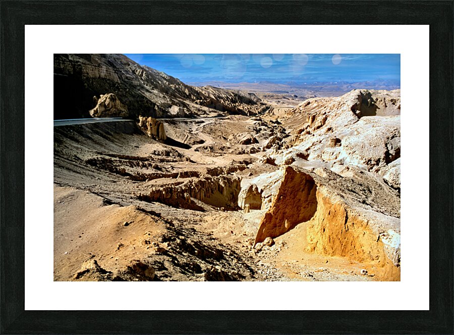 Dramatic arid mountain landscape with a winding road. Picture Frame print