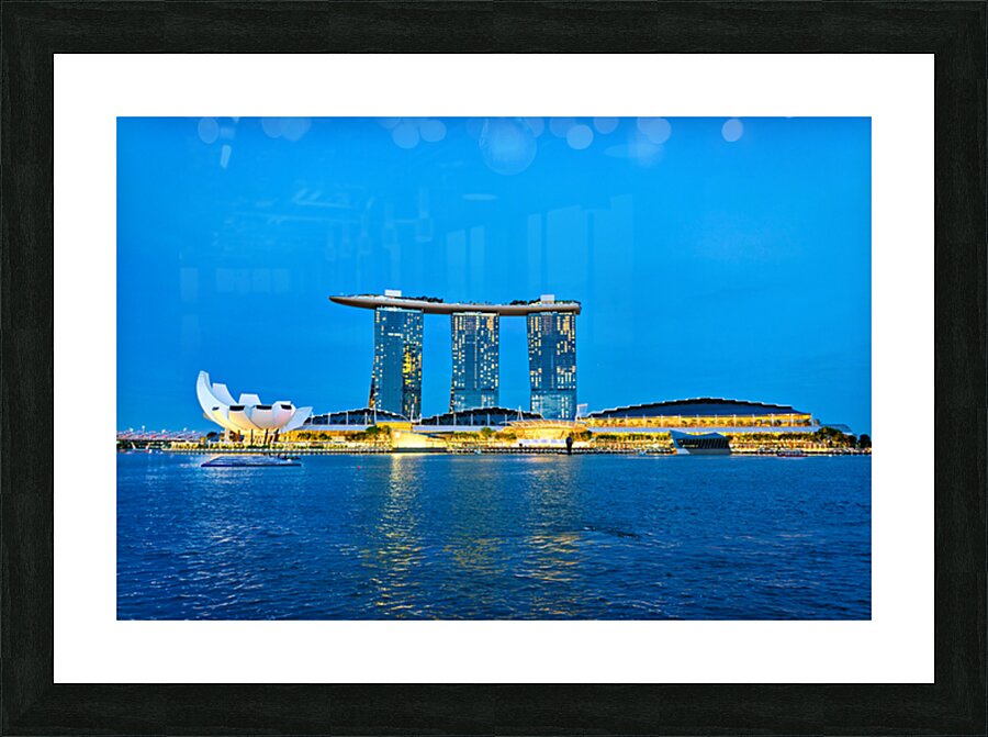 City skyline at sunset over Marina Bay with reflections on water Picture Frame print