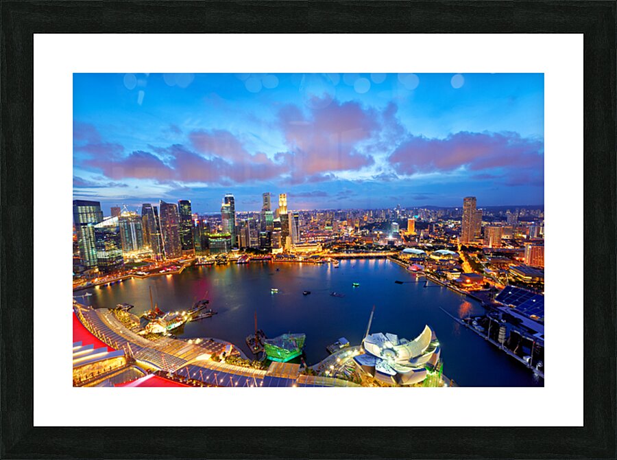 City lights shine over Marina Bay in Singapore at sunset Picture Frame print