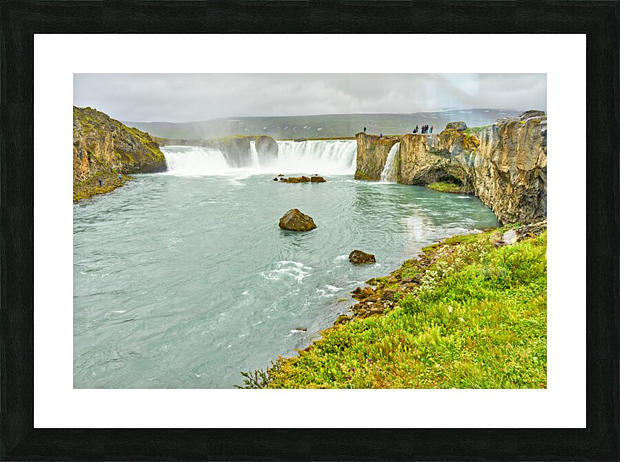 Exploring Godafoss waterfall in Iceland on a cloudy day Picture Frame print