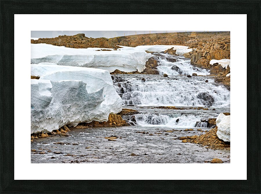 Flowing water and snow near Djupvegur in Iceland Picture Frame print