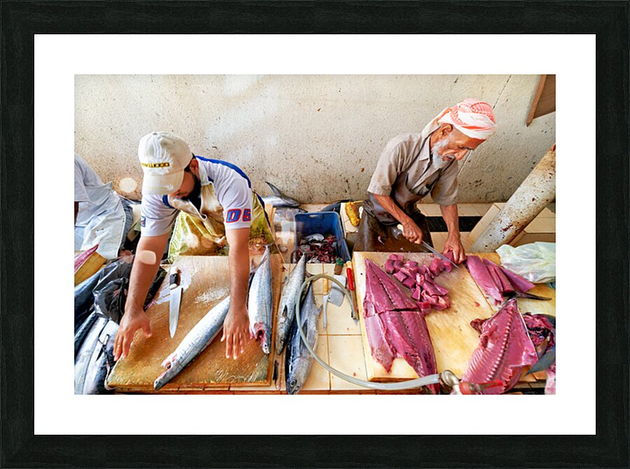 Fish market in Muscat Oman shows workers preparing fish Picture Frame print