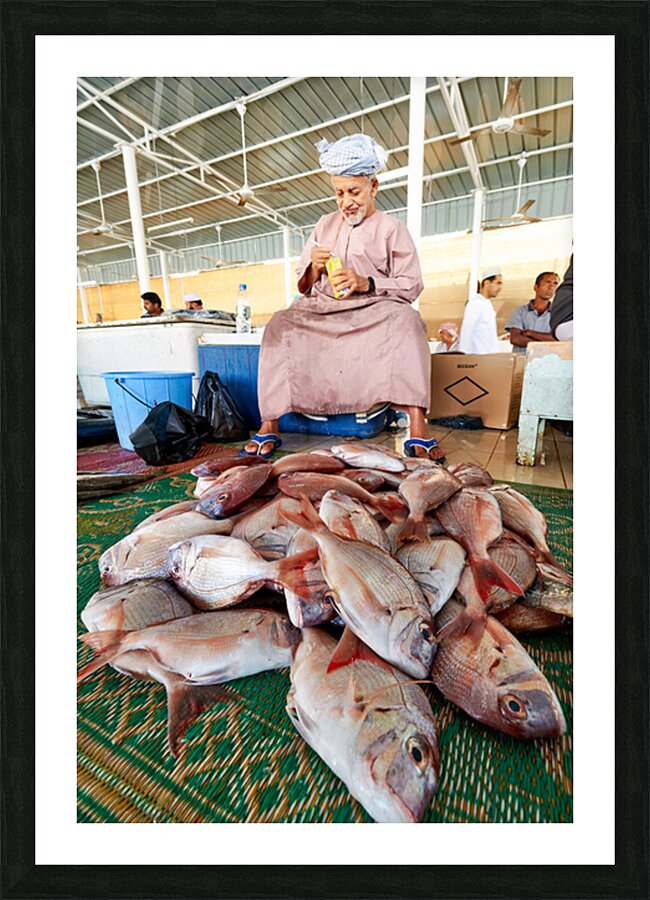 Man sells fresh fish at Muscat Oman fish market today Picture Frame print