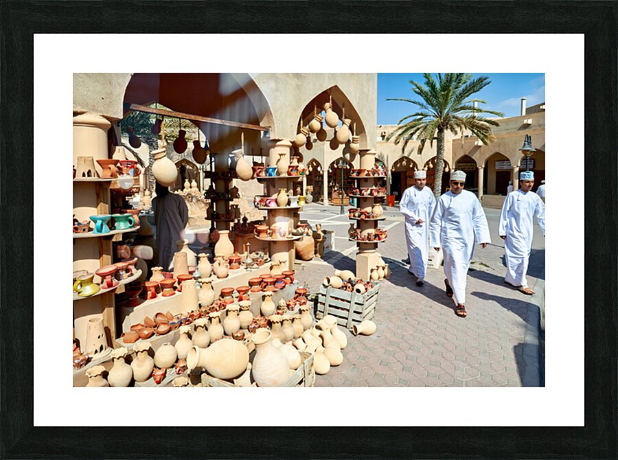 Visitors explore the market at Nizwa Oman during the day Picture Frame print