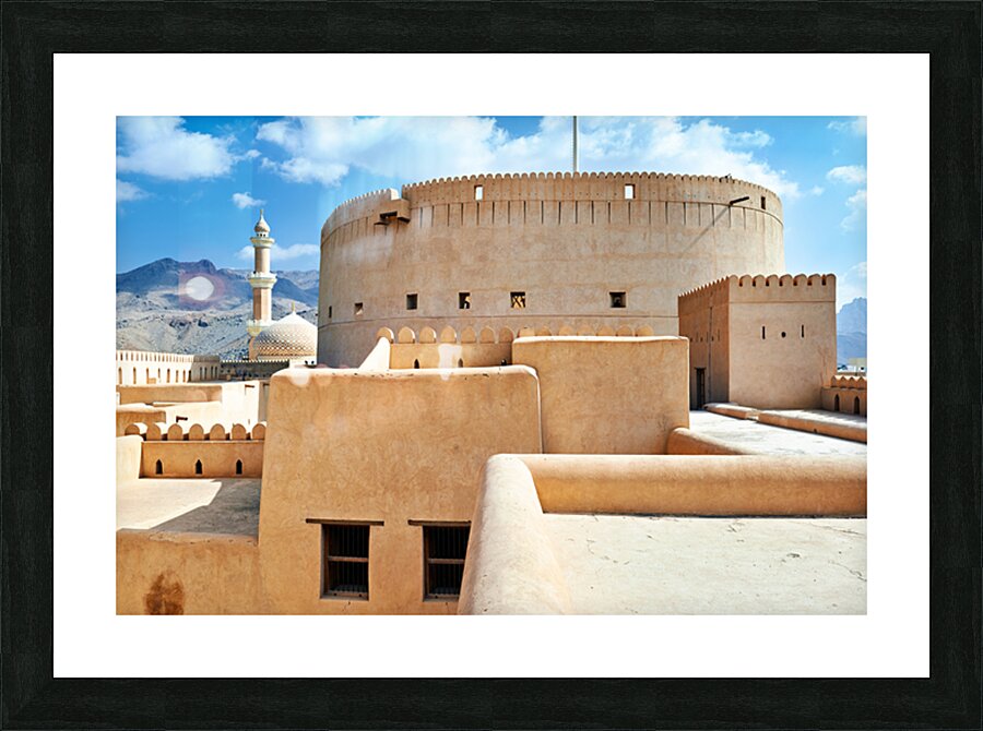 Visitors explore Nizwa Fort a historic site in Oman Picture Frame print