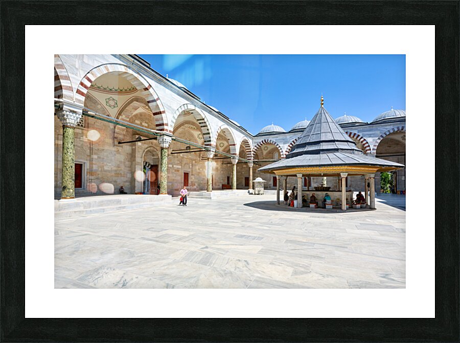 Visitors explore the courtyard at Fatih Mosque in Istanbul Picture Frame print