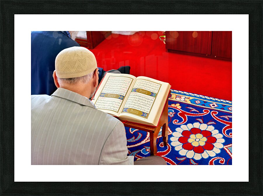 Man reading Quran inside Fatih Mosque in Istanbul Turkey Picture Frame print