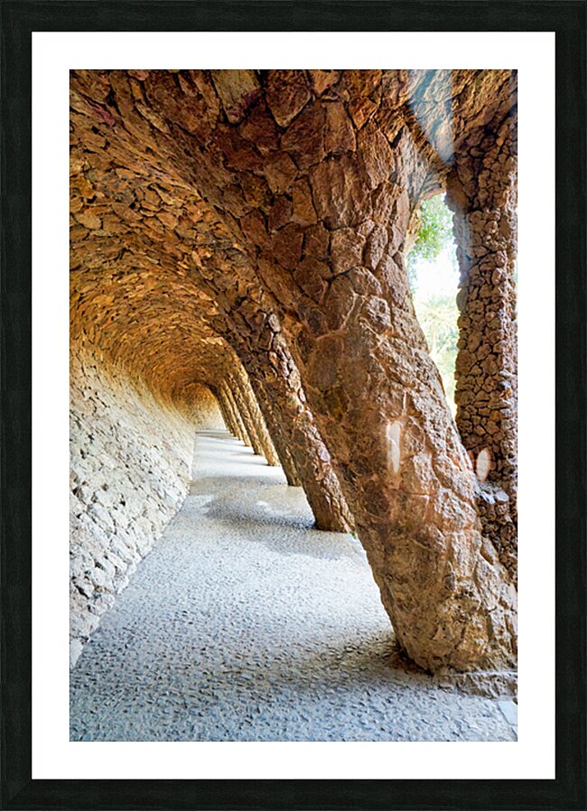 Walking through the colonnaded pathway in Park Guell Barcelona Picture Frame print