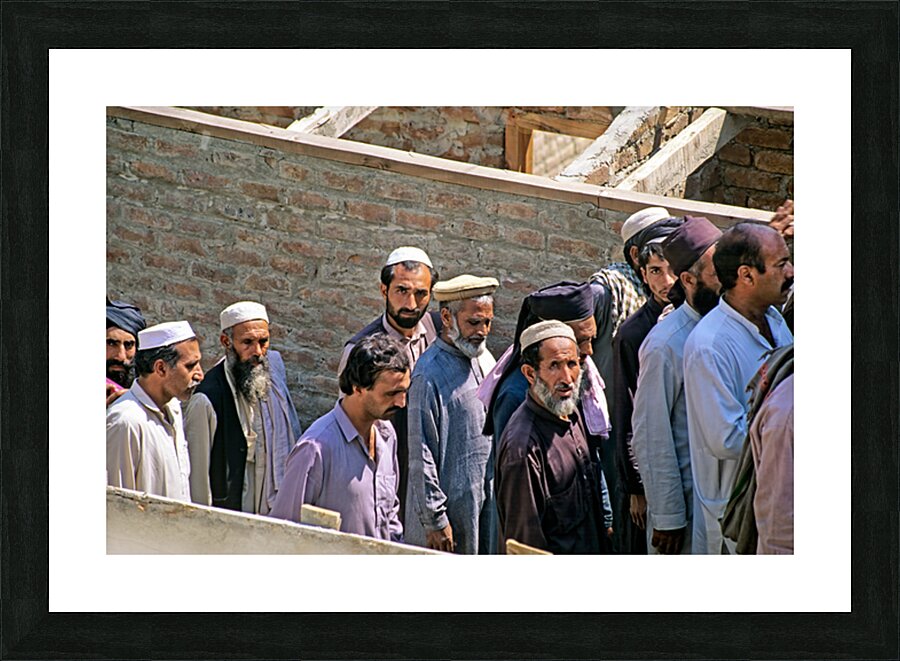 Men heading to work in Peshawar streets during morning hours Picture Frame print