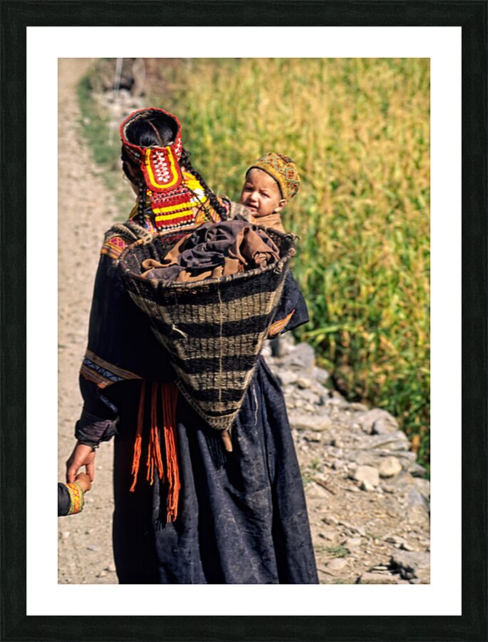 Life in kalash village of bumburet valley with a child Picture Frame print