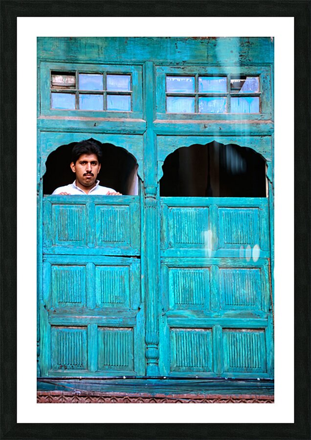 Man looks out from window in Lahore Pakistan Picture Frame print